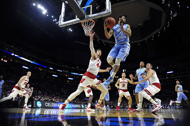 Mar 26, 2015; Los Angeles, CA, USA; North Carolina Tar Heels guard Joel Berry II (2) grabs a rebound against Wisconsin Badgers forward Frank Kaminsky (44) during the first half in the semifinals of the west regional of the 2015 NCAA Tournament at Staples Center. Robert Hanashiro/USA TODAY Sports